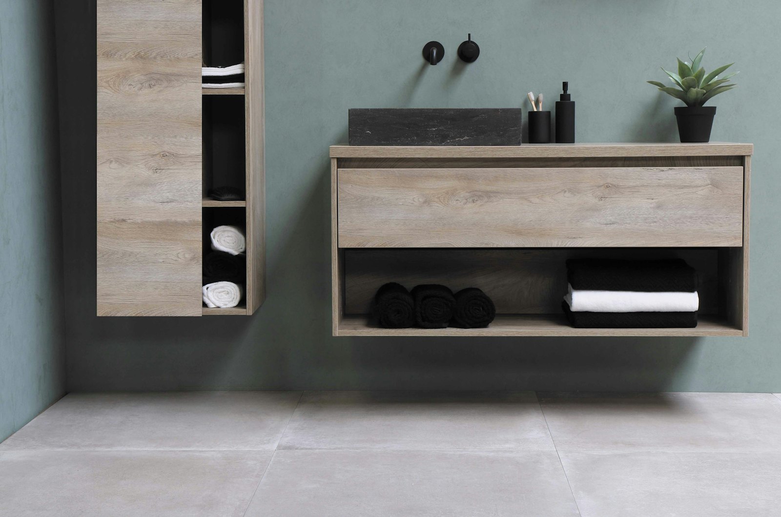 Sage green cloakroom with stone vessel basin on an oak floating vanity