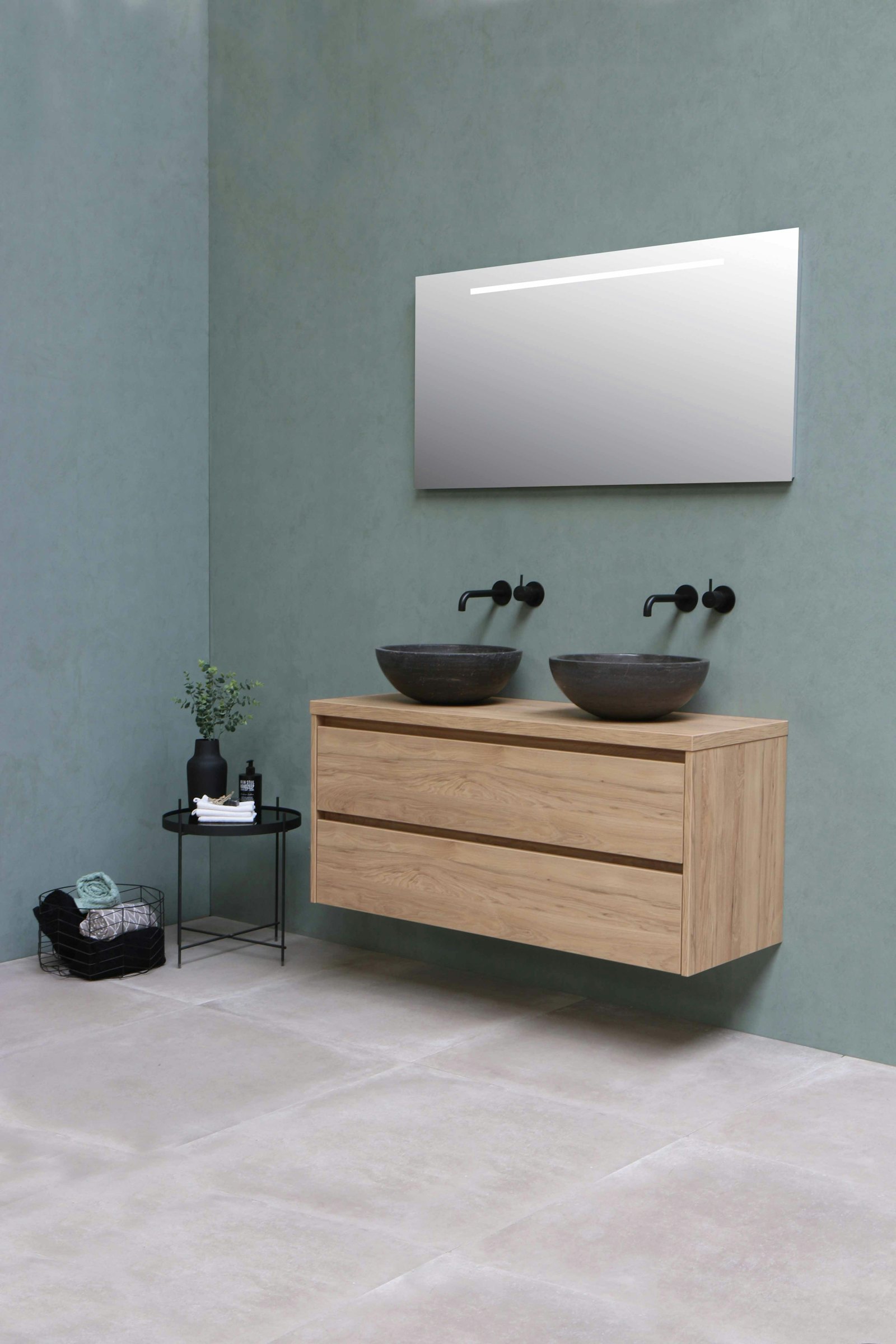 Twin stone basins on an oak vanity